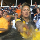 Illustration for article titled This Photo Captures The Moment A Pissed-Off Steelers Fan Threw Her Beer On The Photographer After Tracy Porters Game-Ending INT